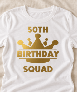 Gold birthday squad crown decal styled on a white T-shirt over ivory linen; clothing not included