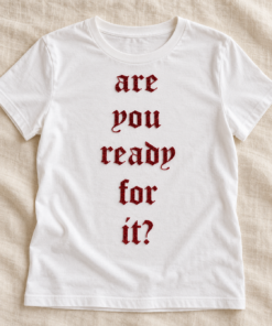 Red glitter concert lettering decal styled on a white T-shirt over ivory linen; clothing not included