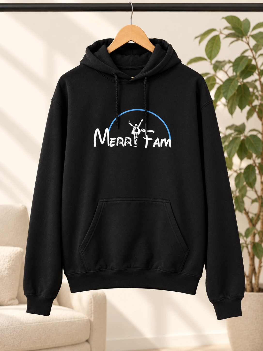 Custom MerryFam hoodie made for a community, displayed on a wooden hanger