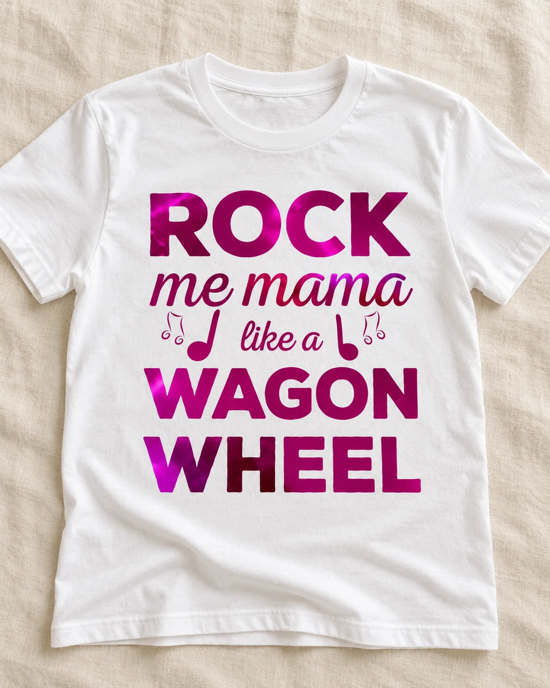 SewLottie pink Rock Me Mama Like a Wagon Wheel vinyl design on a white T-shirt