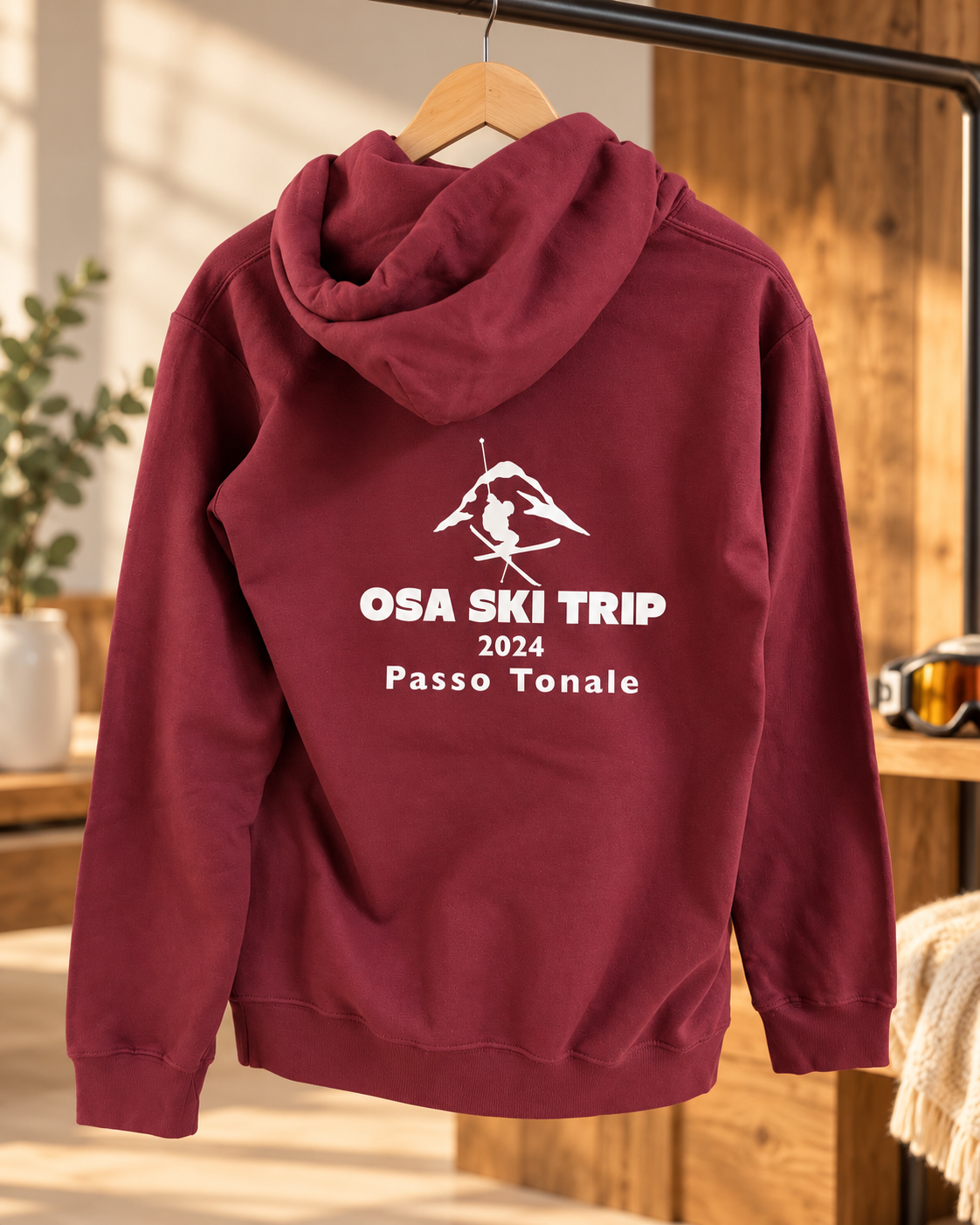 Burgundy OSA Ski Trip 2024 Passo Tonale hoodie with a white ski design on the back