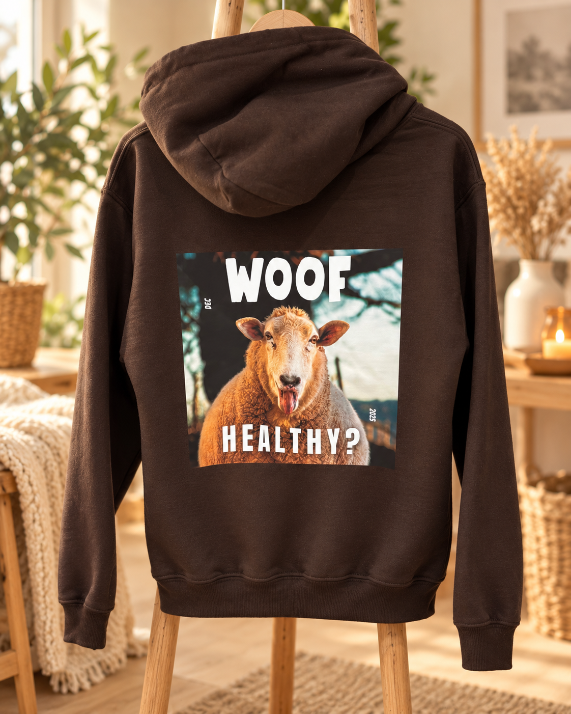 Back of a brown WOOF merchandise hoodie with a sheep graphic and Healthy wording